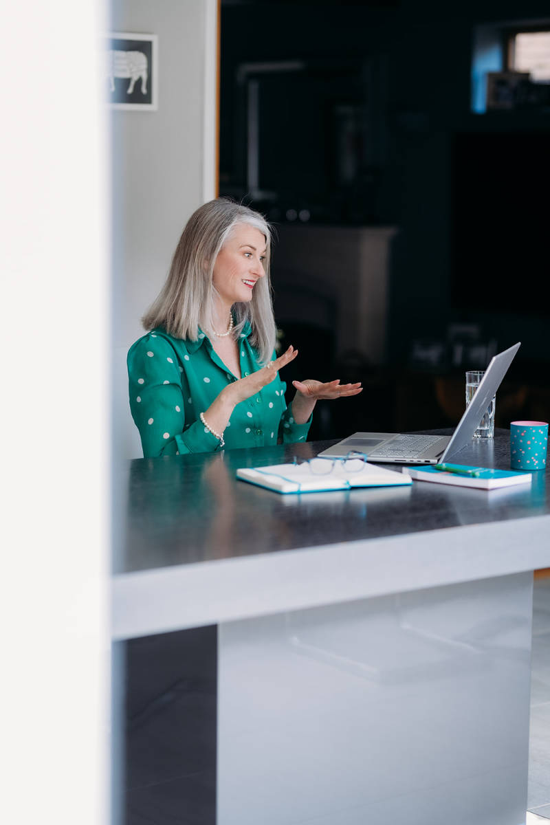 Nicky talking to a client on her laptop