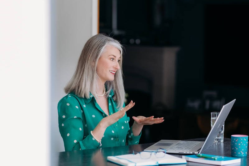 Nicky talking to a client on her laptop